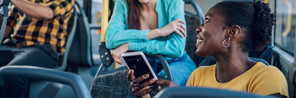 girl in group with mobile phone