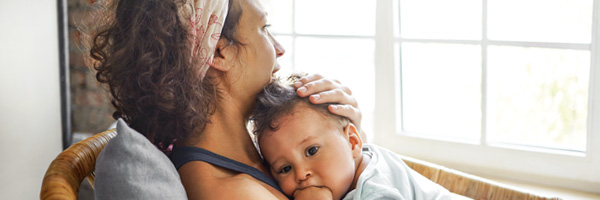 mom holding child